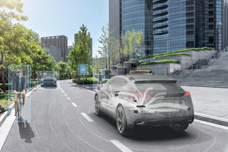 Visual conception of a connected car driving on a city street