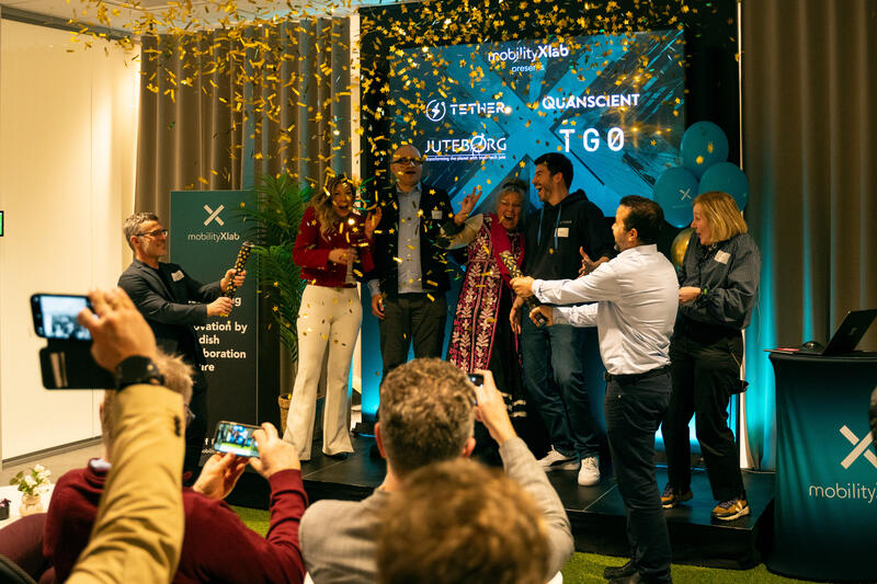 Startups on stage with a golden confetti rain
