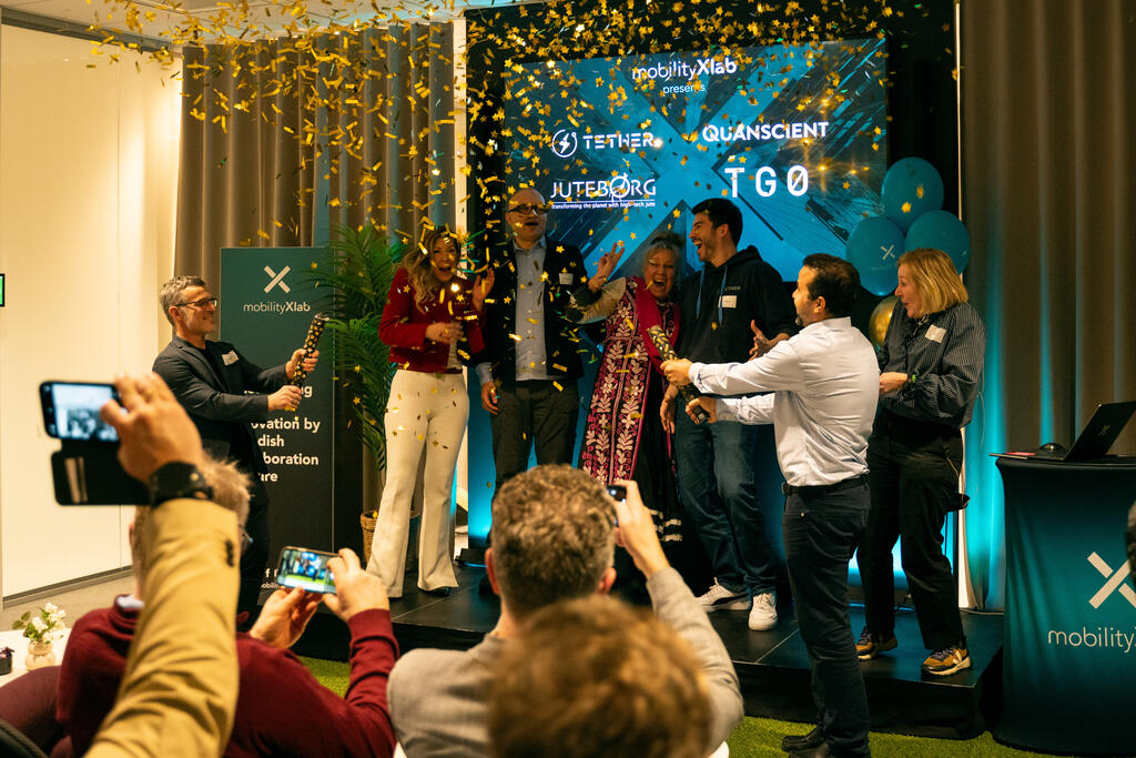 Startups on stage with a golden confetti rain